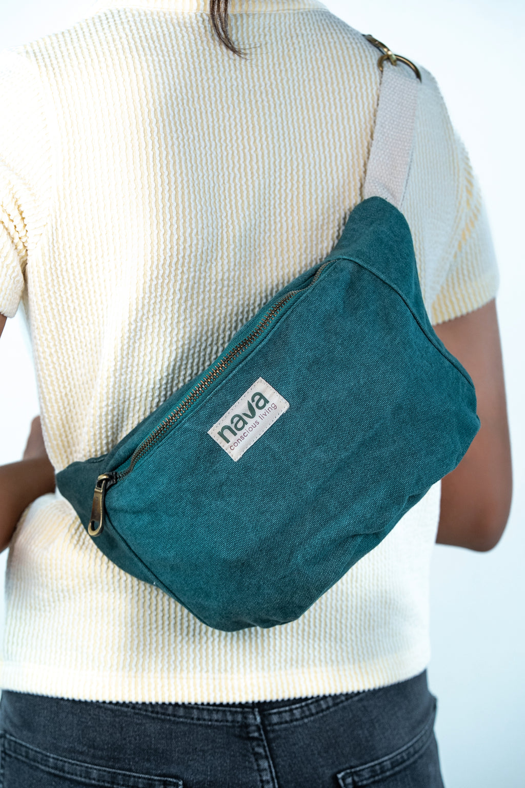 Teenage girl carrying a Nava Eco Friendly Cotton Fanny Pack in Green
