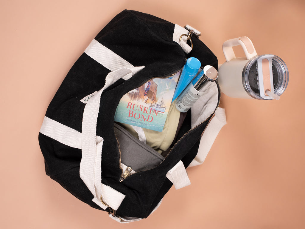 Nava branded eco-friendly cotton duffle bag in black color. Ample storage for travel and sports